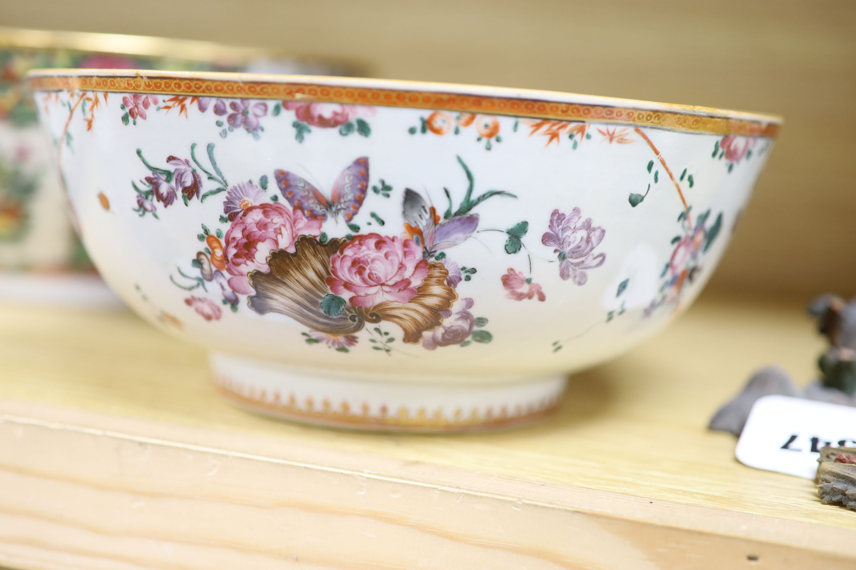 A Chinese pink ground bowl, late 19th century together with two other bowls, a famille verte dish and a plate